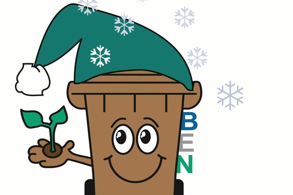 Das Bild zeigt BEN, die Biotonne mit einer M�tze auf dem Kopf umgeben von Schneeflocken